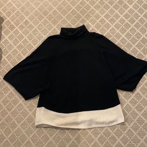 Black tunic with white trim. Sweater